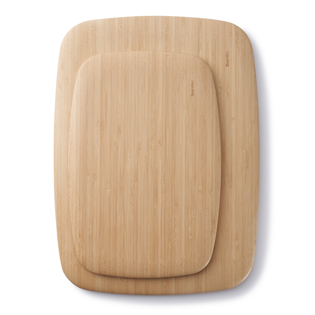 A Medium Classic Cutting Board is stacked atop a Large Classic Cutting Board.