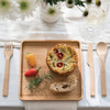 A full set of Bamboo Cutlery is laid out next to a bamboo tray with breakfast foods.